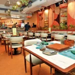 A busy Indian street food stall experiencing challenges due to the India food supply chain heat